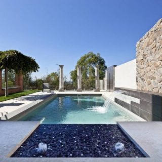 X Trainer fibreglass swimming pool with water wall and sunpod